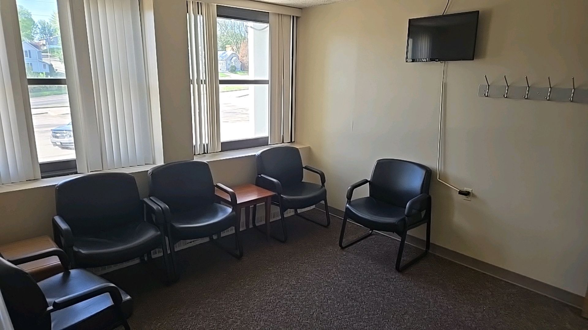 WAITING ROOM TO INCLUDE: CHAIRS, LG FLATSCREEN TELEVISON, END TABLES, WALL MOUNT COAT RACK