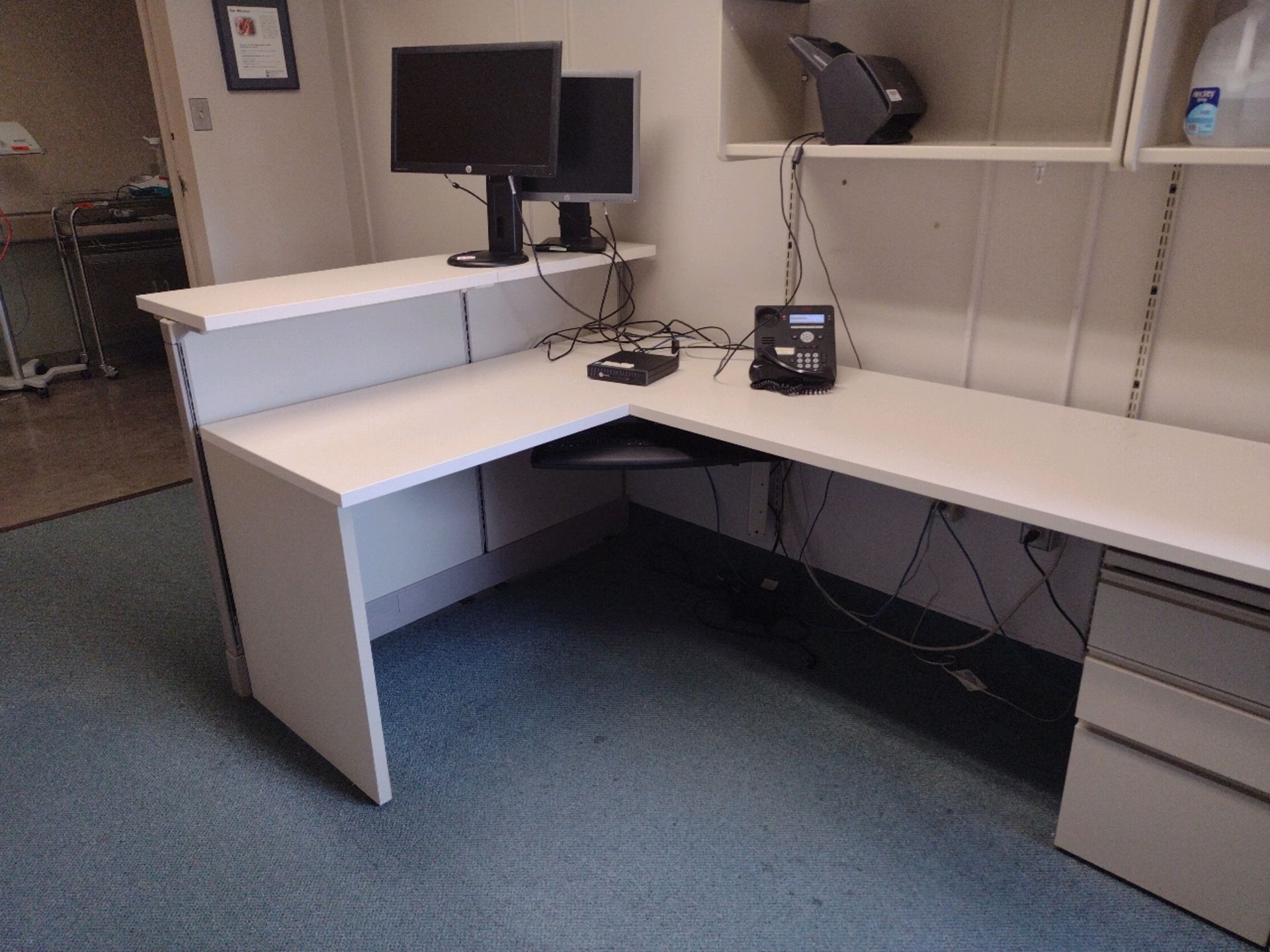 OFFICE TO INCLUDE: MODULAR WORK SPACE WITH OVERHEAD STORAGE, DESK, CHAIR, BOOKCASE AND 2 MONITORS (