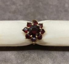 A 9 carat gold garnet ring 4.8 grams size O