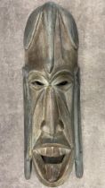 A large vintage African mask 75 cm high, brought to the uk in the 1960’s