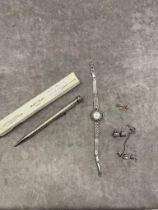 An Eversharp silver propelling pencil, a silver watch with silver brooch and earrings together