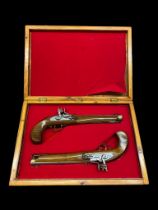 A pair vintage replica of flint lock dualling pistols, boxed