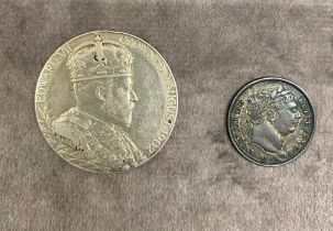 An 1819 George III Shilling together with a man Edward VII 1902 Coronation crown