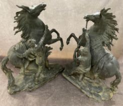 A pair of large bronze horses in the style of Coustou