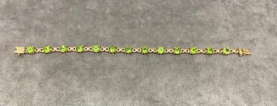 A very good quality bracelet with peridots and diamonds, 9 carat gold 16.5 grams