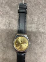 A Seiko automatic watch with black strap