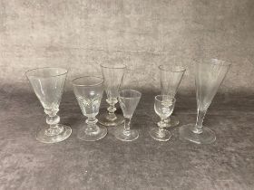 A group of antique drinking glasses