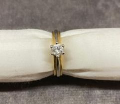 An 18 carat gold ring set with .20 carat diamonds 3.7 grams, size L.5