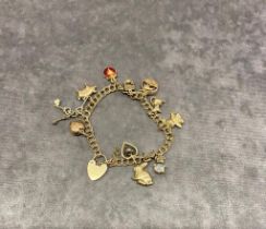 A 9 carat gold charm bracelet 17.2 grams