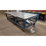 METAL SET OUT TABLE ON TROLLEY WHEELS APPROX 9' X 4' (NOTE: ASSETS LOCATED IN NEWCASTLE-UNDER-