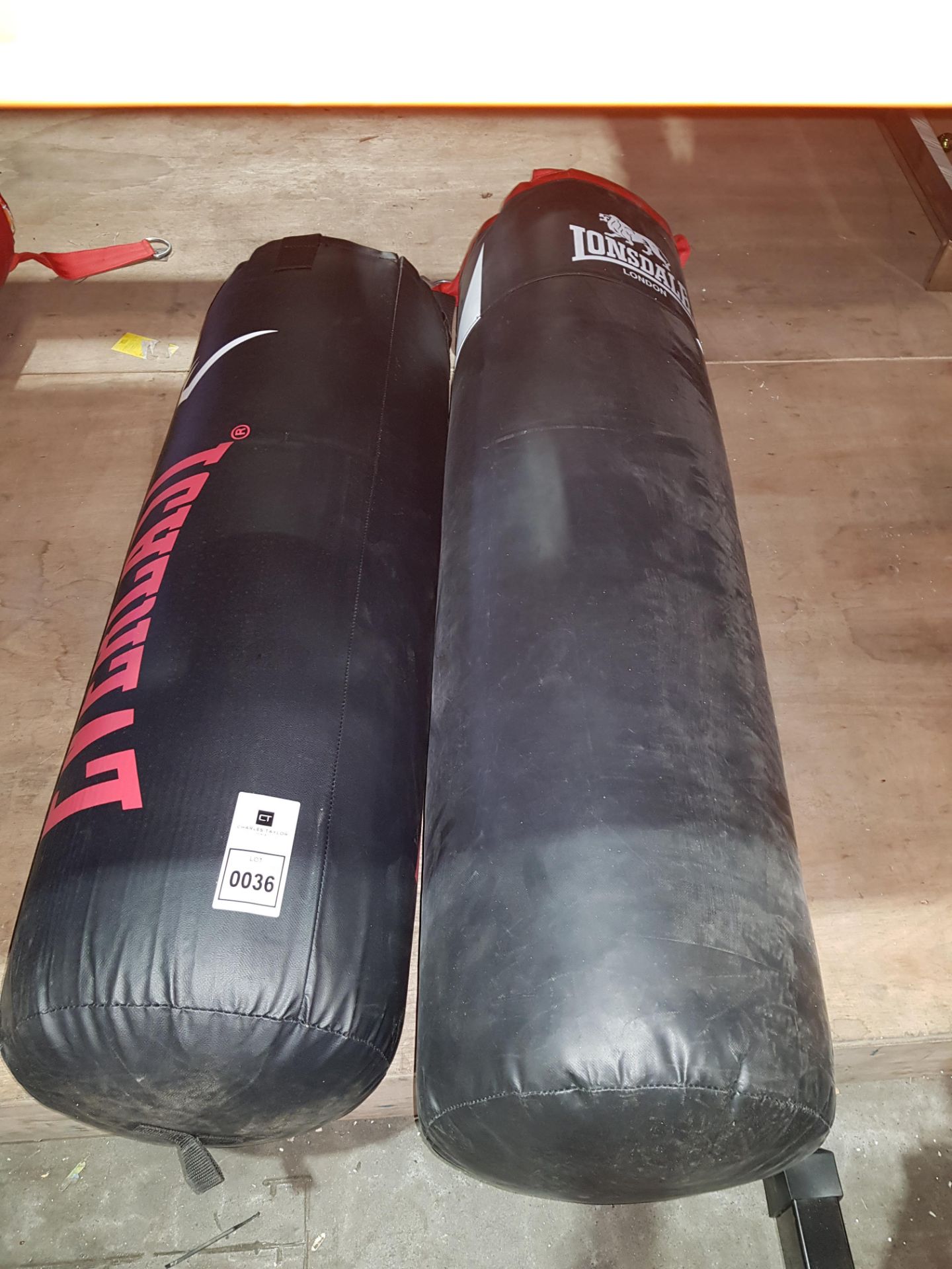 1 X LONSDALE 4 FT LEATHER PUNCH BAG AND 1 X EVERLAST 3 AND HALF FT LEATHER PUNCH BAG