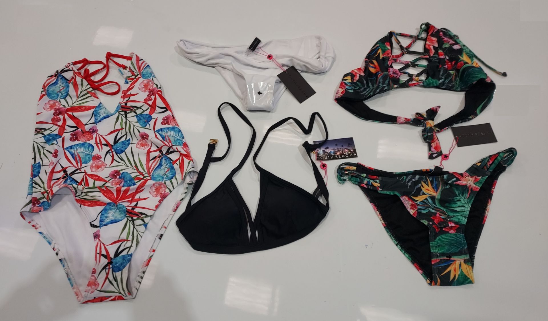 100 X BRAND NEW MIXED CLOTHING LOT CONTAINING SOUTH BEACH DEEP V EMBROIDED TIE SIDE BIKINI BOTTOMS /