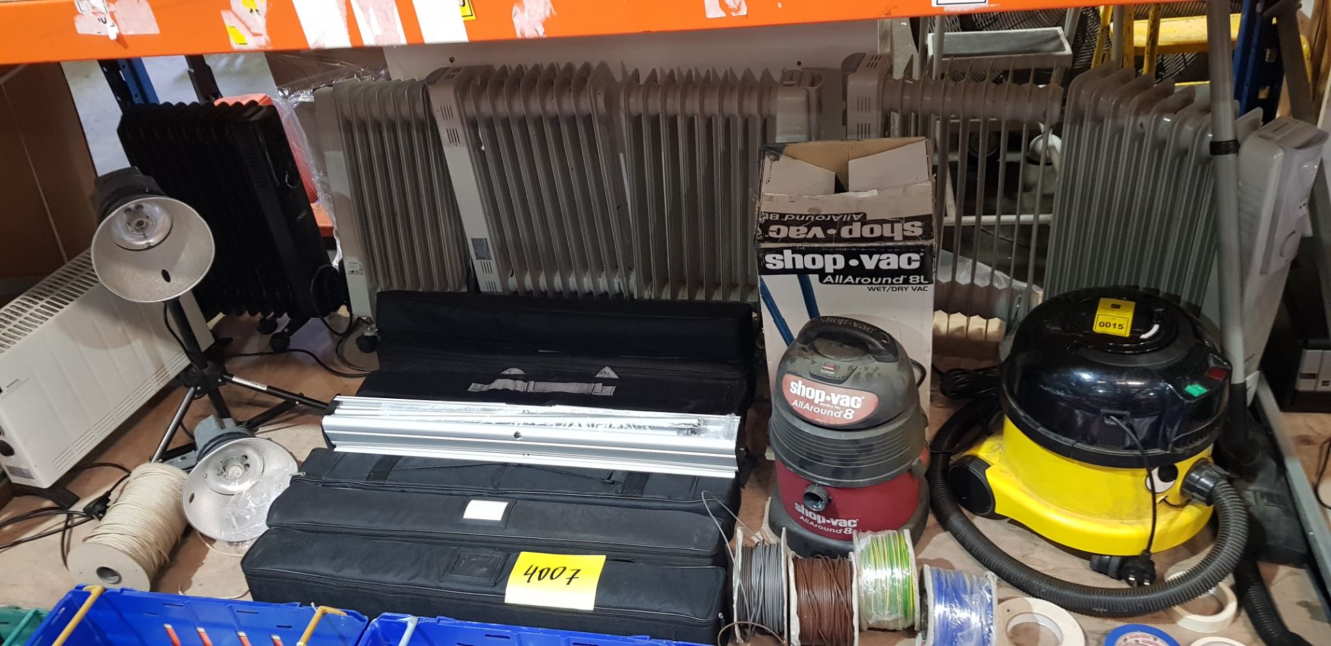 FULL BAY MIXED LOT CONTAINING 7 ELECTRIC HEATERS , 1 SHOP.VAC ,, WET/DRY VAC , YELLOW HENRY HOOVER ,