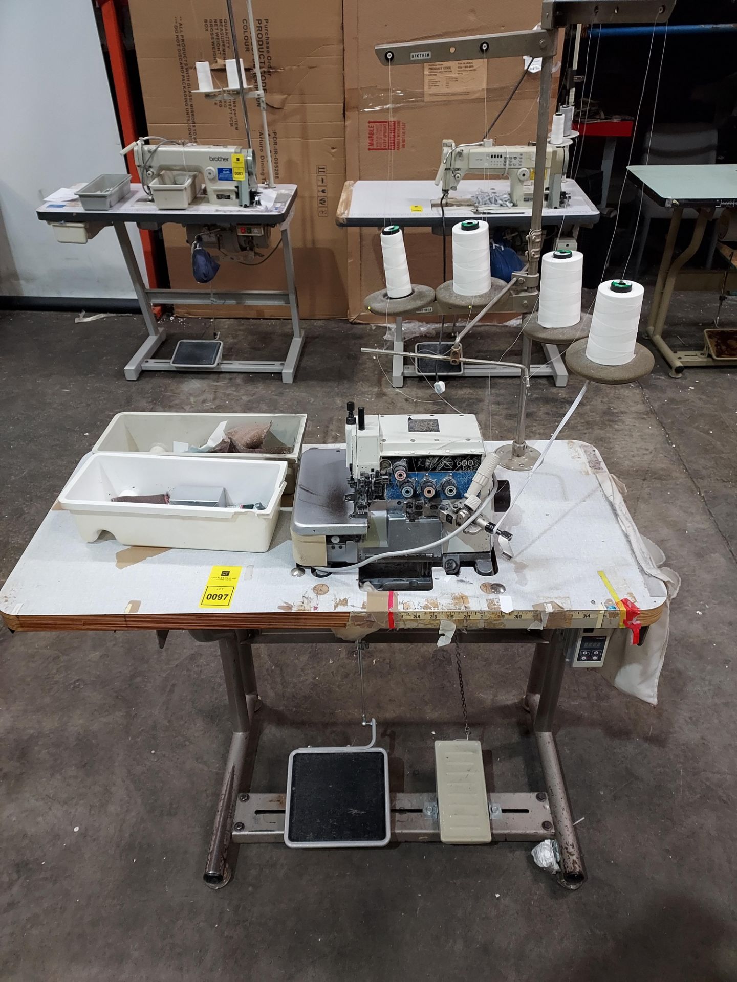1 X BROTHER ( 600) INDUSTRIAL 4 THREAD OVERLOCKER SEWING MACHINE - WITH FOOT PEDAL AND TABLE