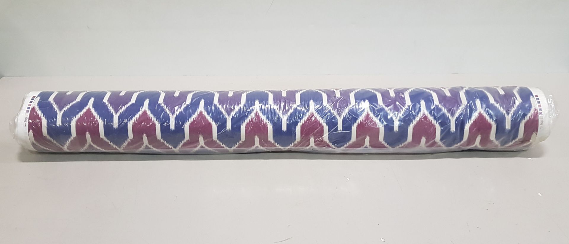 1 X ROLL OF FABRIC IN PURPLE RED AND BLUE WAVY DESIGN - LENGTH 50 M - RRP £12.99 / M - TOTAL £649.