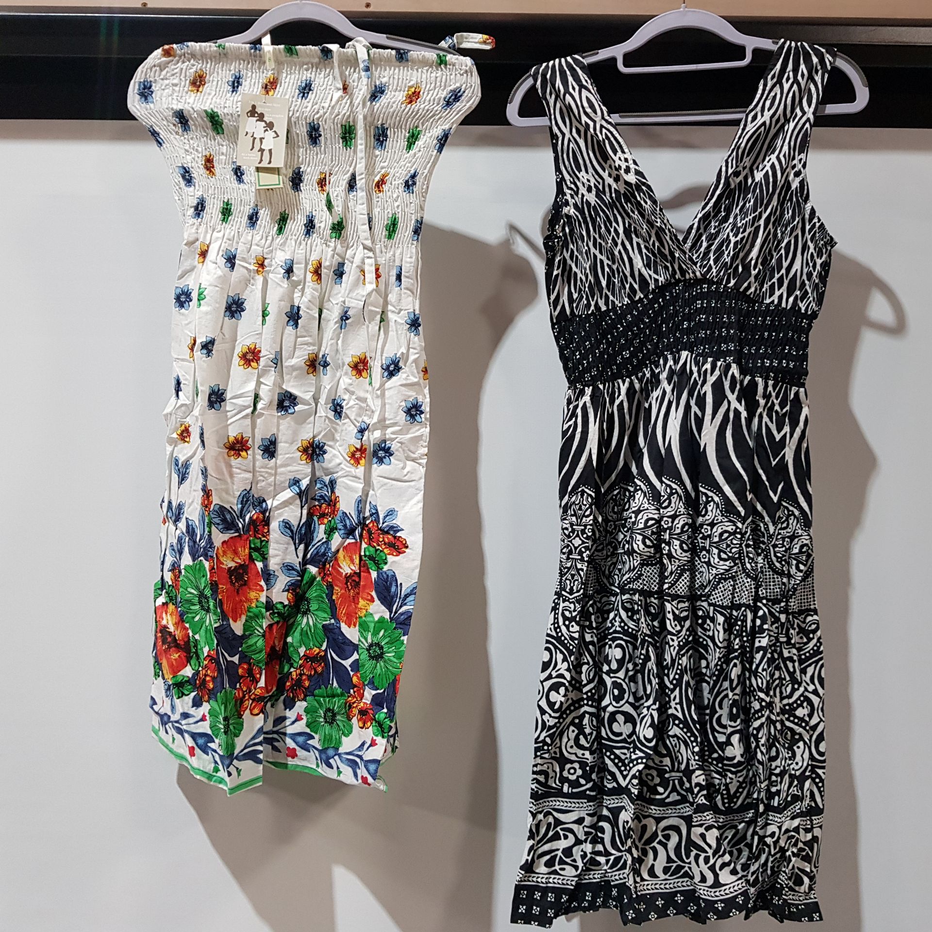 22 X BRAND NEW PISTACHIO SUMMER DRESSES, 10 IN BLACK AND WHITE SIZE LARGE, 12 DRESSES IN FLORAL