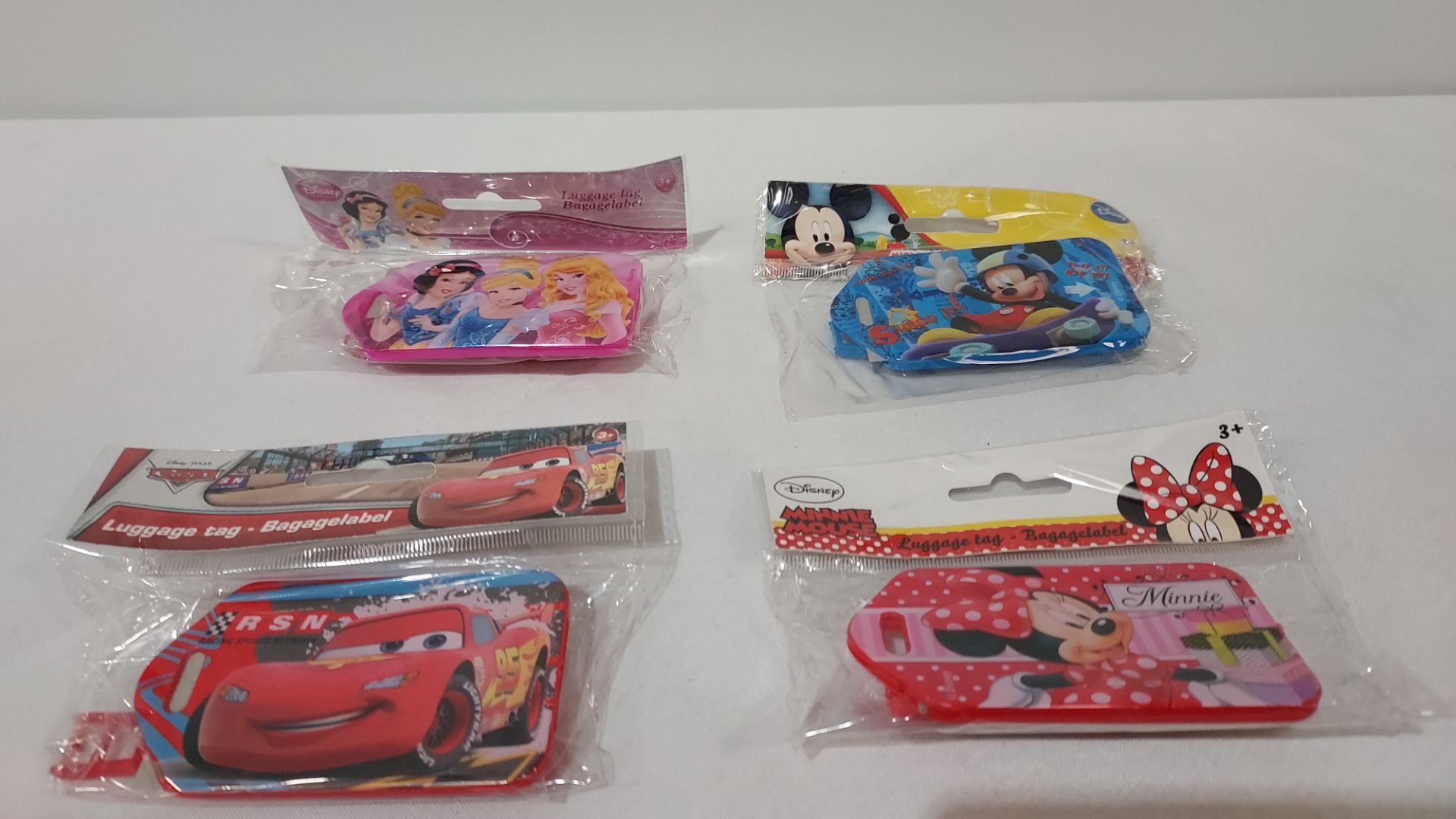 36 X PACKS OF 48 PIECE BRAND NEW DISNEY KIDS LUGGAGE TAGS WITH VARIOUS CHARACTERS THIS INCLUDES