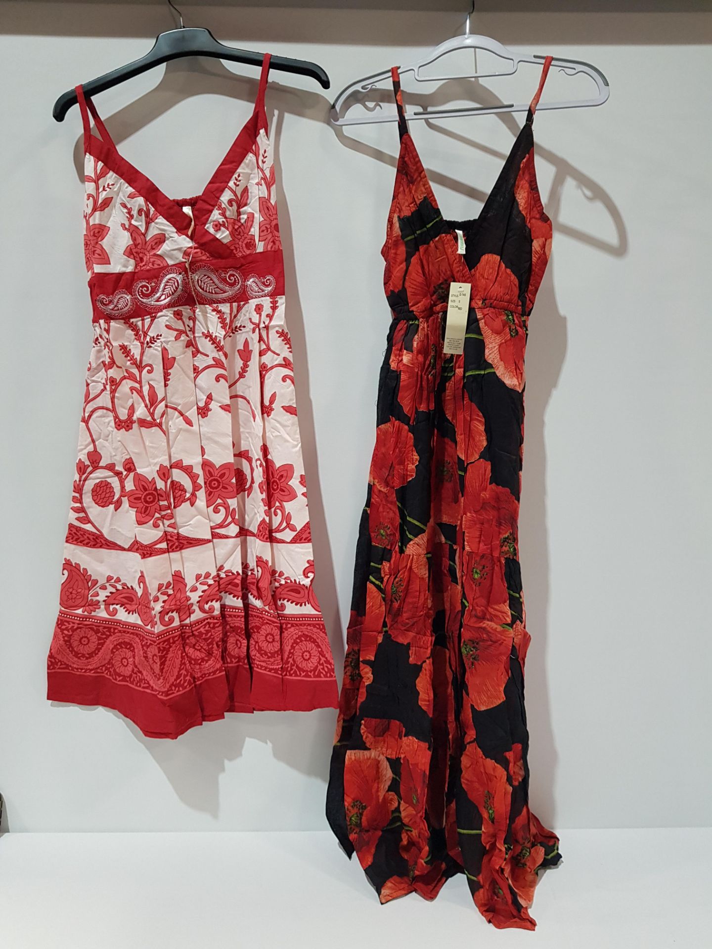 24 X BRAND NEW PISTACHIO DRESSES IN TWO FLORAL DESIGN'S IN RED SIZE SMALL ( £25 EACH TOTAL £600 ) IN