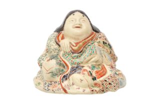 A JAPANESE SATSUMA FIGURE OF OKAME