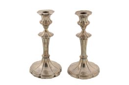 A pair of Edwardian sterling silver candlesticks, Sheffield 1909 by Walter Latham and Son