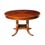 SIMON LOSCERTALES BONA, SPAIN; A LOUIS XVI STYLE CIRCULAR MAHOGANY AND PARCEL GILT EXTENDING DINING 