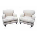 H J COOPER LTD OF PUTNEY; A PAIR OF CONTEMPORARY HOWARD STYLE ARMCHAIRS