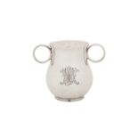 A Victorian sterling silver 'Ox Eye' or college twin handled cup, London 1863 by George John Richard