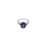 A SYNTHETIC SAPPHIRE AND DIAMOND RING