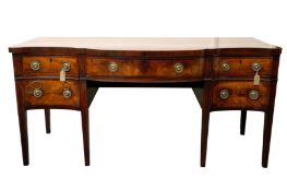 A GEORGE III MAHOGANY SERPENTINE-FRONTED SIDEBOARD