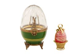 A late 20th century silver gilt, gilt metal, ceramic and glass novelty egg, by “Faberge”