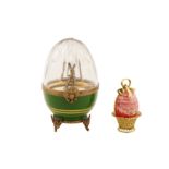 A late 20th century silver gilt, gilt metal, ceramic and glass novelty egg, by “Faberge”