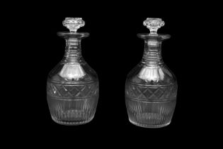 A PAIR OF GEORGE III CUT GLASS DECANTERS OF MALLET SHAPE, CIRCA 1800