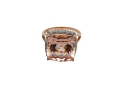 A MORGANITE AND DIAMOND RING 