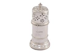 A GEORGE V ARTS AND CRAFTS STERLING SILVER PEPPER POT, LONDON 1914 BY THE GUILD OF HANDICRAFT (GEORG