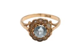 AN AQUAMARINE AND SEED PEARL CLUSTER RING