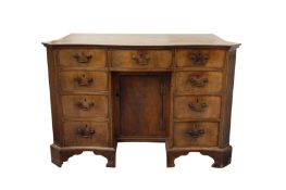 A GEORGE III CROSS BANDED MAHOGANY SERPENTINE KNEEHOLE DRESSING TABLE, CIRCA 1770