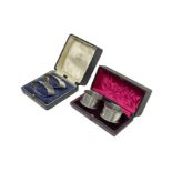 TWO CASED PAIRS OF STERLING SILVER NAPKIN RINGS