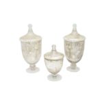 A GARNITURE OF THREE FRENCH SILVERED GLASS LIDDED VASES