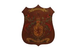 AN EARLY 20TH CENTURY MAHOGANY WALL HANGING SHIELD