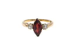 A THREE-STONE GARNET AND DIAMOND RING