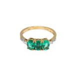 A THREE-STONE EMERALD RING