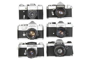 Six Mechanical 35mm SLR Cameras with lenses.