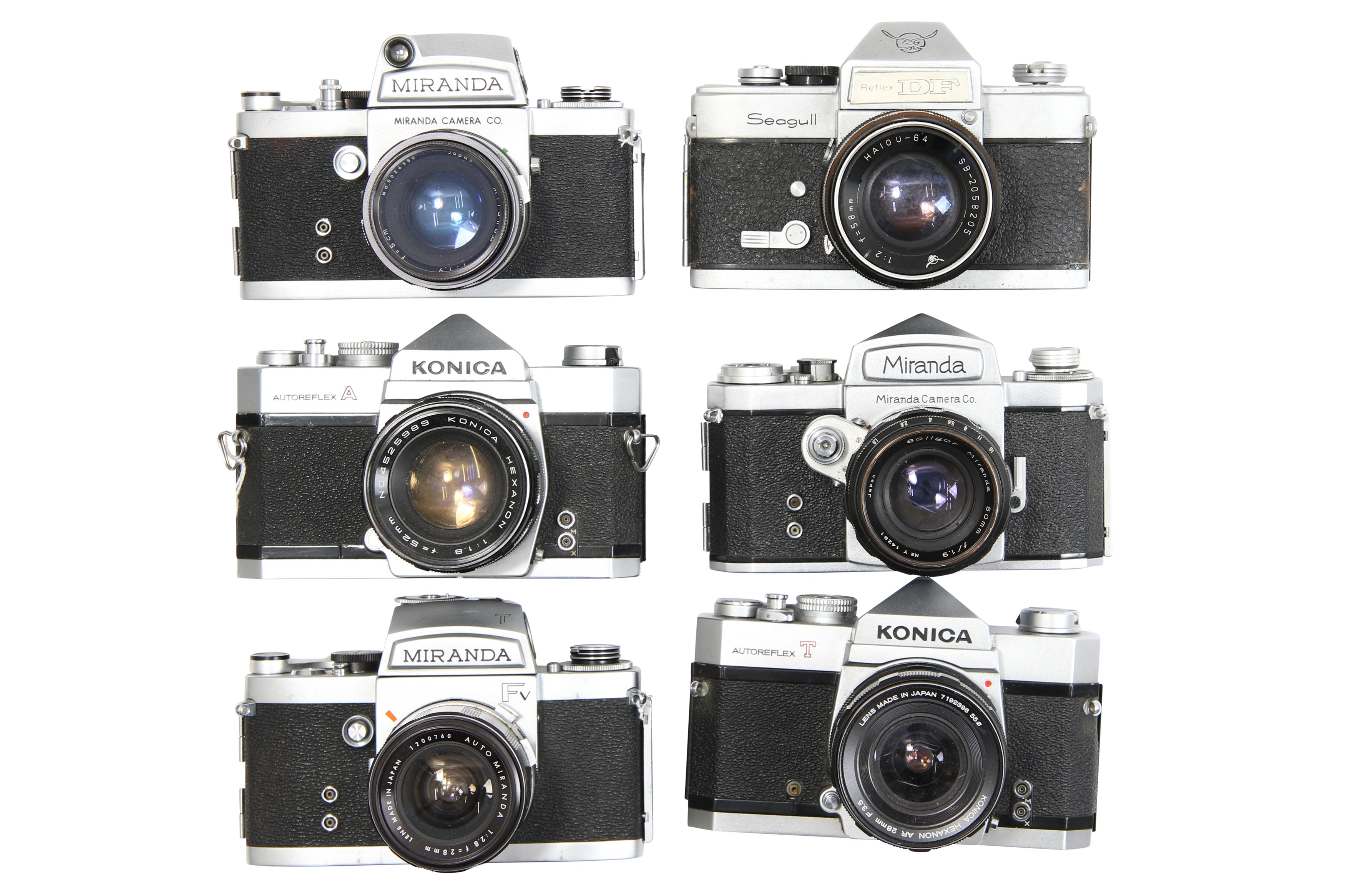 Six Mechanical 35mm SLR Cameras with Lenses.