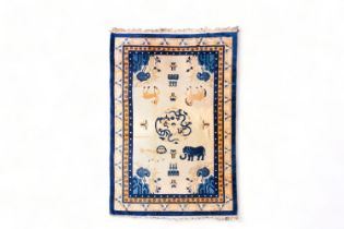 A Chinese woolen 'Beijing' pictorial animal rug with a blue elephant, first quarter of the 20th Cent