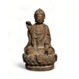 A Chinese stone figure of Buddha with, 19th Century