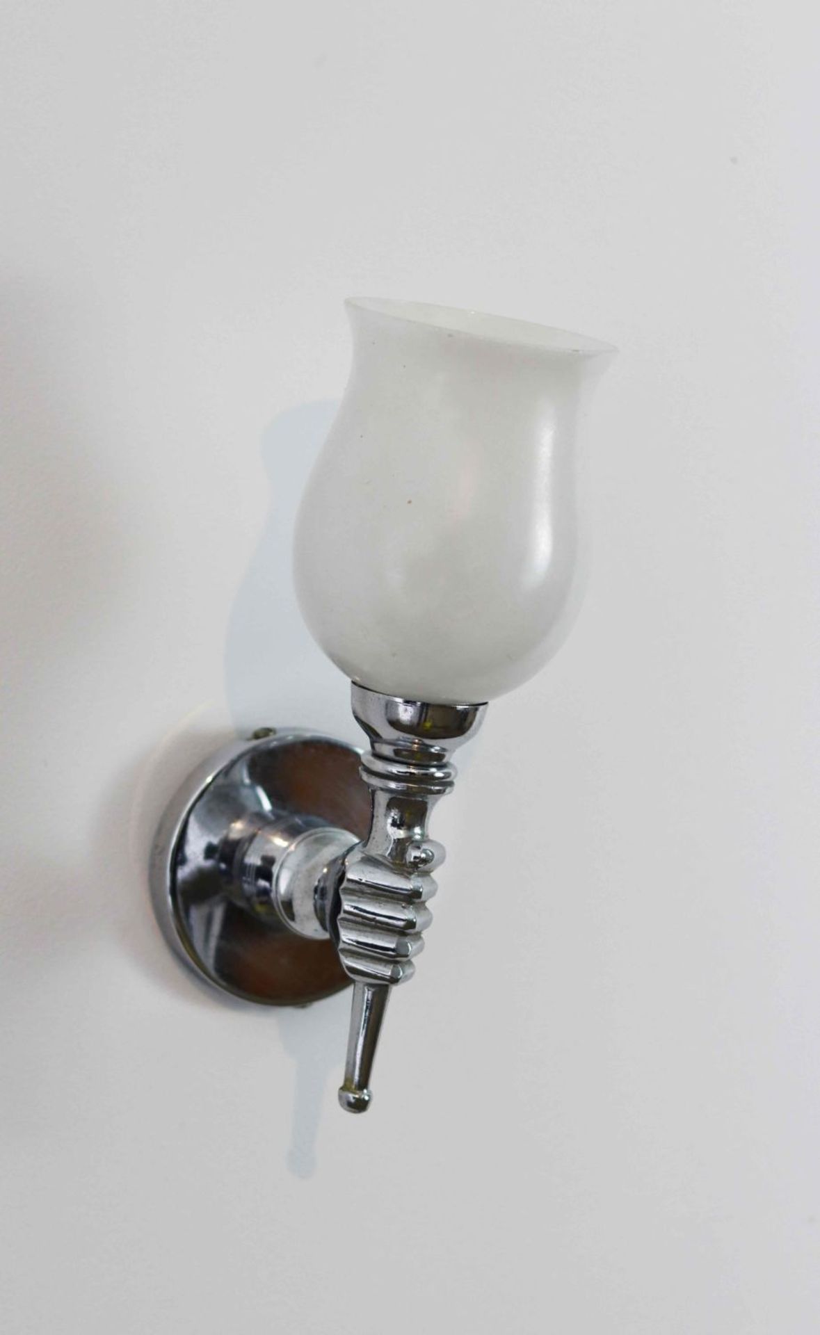 A hand sconce, chromed metal, 20th Century