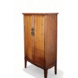 A Chinese cypress wood cabinet, 19th/20th Century