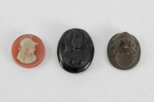 A Victorian mourning vulcanite cameo locket, A cornelian cameo depicting Hermes and an obsidian came