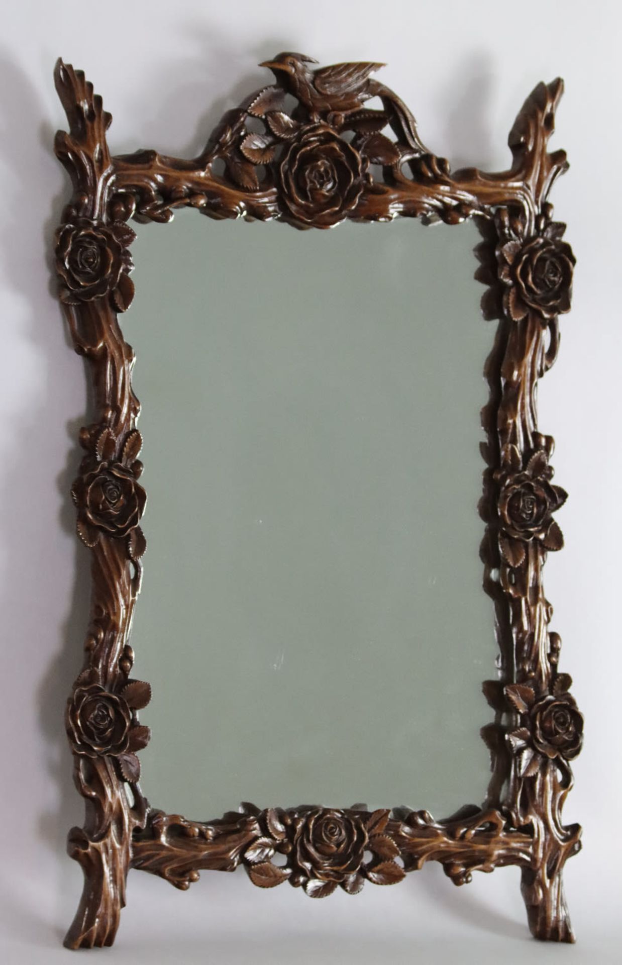 A Chinese mirror shaped with carved flowers and branches, first half 20th Century
