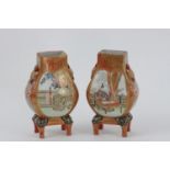 A pair of finely painted Japanese Kutani vases. Meiji period